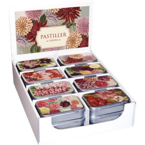 ske med pastiller. Mrke blomster. ferskensmag